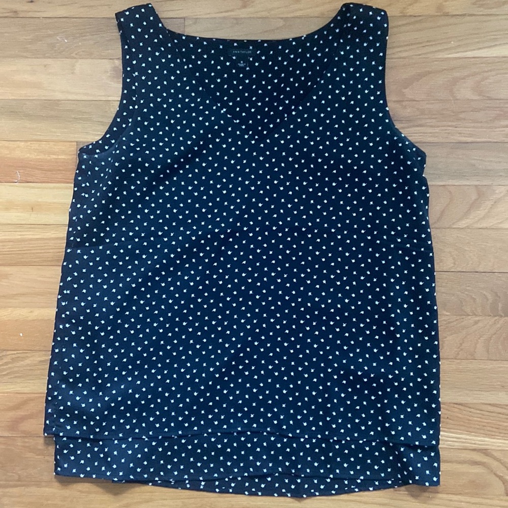 Sleeveless top, black with white polka dots